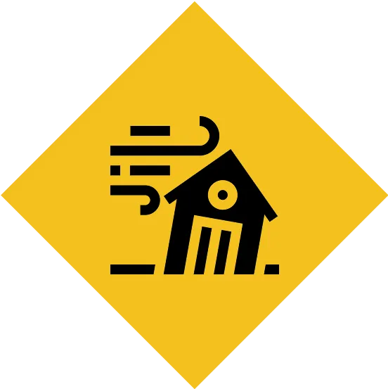 Yellow warning sign with windblown house.